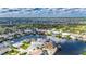 Wonderful aerial showing waterfront homes with boat docks and beautiful landscaping in a serene community at 927 Golf Island Dr, Apollo Beach, FL 33572