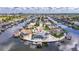 Stunning aerial view of waterfront property in a charming neighborhood with private boat dock and mature landscaping at 927 Golf Island Dr, Apollo Beach, FL 33572