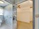 This bathroom features mirrored closet, walk-in closet, toilet and decorative wallpaper at 927 Golf Island Dr, Apollo Beach, FL 33572
