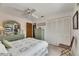 Comfortable bedroom featuring a ceiling fan, light green decor, and a closet with folding doors at 927 Golf Island Dr, Apollo Beach, FL 33572