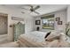 Bedroom featuring carpet, view of canal and a ceiling fan at 927 Golf Island Dr, Apollo Beach, FL 33572