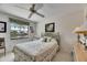 Light and airy bedroom with water view, ceiling fan, carpet and painted furniture at 927 Golf Island Dr, Apollo Beach, FL 33572