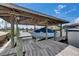 The covered boat dock and lift offering convenient access to the waterfront lifestyle at 927 Golf Island Dr, Apollo Beach, FL 33572