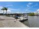 Beautiful view of the dock with boat lift, offering convenient access to waterfront activities at 927 Golf Island Dr, Apollo Beach, FL 33572