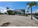 Exterior showcasing a waterfront home with lush landscaping, a boat dock and a screened lanai at 927 Golf Island Dr, Apollo Beach, FL 33572