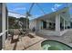 Charming screened patio featuring a hot tub and lounge chairs, perfect for relaxation and enjoying a tranquil outdoor experience at 927 Golf Island Dr, Apollo Beach, FL 33572