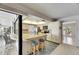 Kitchen with breakfast bar has white cabinets and stainless steel appliances at 927 Golf Island Dr, Apollo Beach, FL 33572