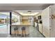 Open kitchen offers a breakfast bar with seating, stainless steel appliances, and a view of the pool area at 927 Golf Island Dr, Apollo Beach, FL 33572