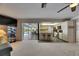 Open kitchen features a breakfast bar, stainless appliances, and seamless indoor/outdoor living at 927 Golf Island Dr, Apollo Beach, FL 33572
