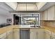 Kitchen features a breakfast bar and stainless steel dishwasher at 927 Golf Island Dr, Apollo Beach, FL 33572