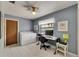 Laundry room with washer, dryer, desk, and natural light from the window at 927 Golf Island Dr, Apollo Beach, FL 33572