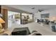 Spacious open-concept living area featuring an adjacent kitchen, comfortable seating, and natural light at 927 Golf Island Dr, Apollo Beach, FL 33572