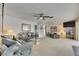 Cozy living room with comfortable seating, neutral carpet, and warm lighting, creating a relaxing atmosphere at 927 Golf Island Dr, Apollo Beach, FL 33572