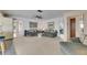 Open living space with views to another room, featuring comfortable seating, and natural light at 927 Golf Island Dr, Apollo Beach, FL 33572