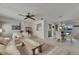 Comfortable living and dining area with a ceiling fan, neutral decor, and an open layout for entertaining at 927 Golf Island Dr, Apollo Beach, FL 33572