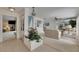Spacious living room with neutral decor, tile floors, and view into the living spaces beyond at 927 Golf Island Dr, Apollo Beach, FL 33572