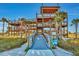 View of the outdoor observation tower with surrounding plants and access bridge at 927 Golf Island Dr, Apollo Beach, FL 33572