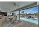Inviting screened patio featuring a refreshing pool and relaxing dining space with waterfront views, ideal for outdoor enjoyment at 927 Golf Island Dr, Apollo Beach, FL 33572