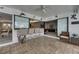 Elegant screened patio with a bar area, seamless indoor-outdoor flow, and comfortable seating, great for entertaining at 927 Golf Island Dr, Apollo Beach, FL 33572