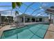 Stunning screened pool and patio area with a hot tub, offering a luxurious and private outdoor retreat at 927 Golf Island Dr, Apollo Beach, FL 33572