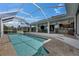 Gorgeous screened pool and patio area with outdoor seating, creating a perfect setting for relaxation and entertainment at 927 Golf Island Dr, Apollo Beach, FL 33572