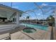 Beautiful screened pool and hot tub area with an outdoor patio, ideal for relaxation and enjoying the Florida sunshine at 927 Golf Island Dr, Apollo Beach, FL 33572