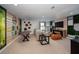 Spacious bonus room featuring recreational space, comfortable seating, and unique decor at 10006 Surrey Rose Dr, San Antonio, FL 33576
