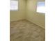 Bedroom featuring tile floors, base trim, and a double window with blinds at 10817 Fillmore Ave, Port Richey, FL 34668