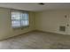 Well-lit living room features lots of natural light and neutral colored walls at 10817 Fillmore Ave, Port Richey, FL 34668