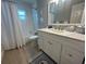 Bright bathroom with a modern vanity, a large mirror, and a shower-tub combo at 1137 Treasure Cay Ct, Punta Gorda, FL 33950