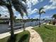 Waterfront property with private dock and stone pathway leading to the canal at 1137 Treasure Cay Ct, Punta Gorda, FL 33950