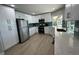 Modern kitchen with stainless steel appliances, white cabinetry, and quartz countertops at 1137 Treasure Cay Ct, Punta Gorda, FL 33950