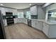 Bright kitchen with stainless steel appliances, white cabinetry, and quartz countertops at 1137 Treasure Cay Ct, Punta Gorda, FL 33950