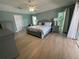 Serene main bedroom with a king-size bed, neutral tones, and access to a private outdoor area at 1137 Treasure Cay Ct, Punta Gorda, FL 33950