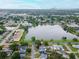 Scenic aerial view of property and lake, with cityscape in the background at 1180 39Th N St, St Petersburg, FL 33713