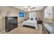 Cozy bedroom showcasing a plush bed, dark wood furniture, and a bright window at 1180 39Th N St, St Petersburg, FL 33713