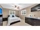 Comfortable bedroom features a well-lit window and dark furniture, creating a cozy retreat at 1180 39Th N St, St Petersburg, FL 33713