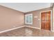 Welcoming entryway with tile flooring, dark trim, window, and front door, creating a warm arrival at 1180 39Th N St, St Petersburg, FL 33713