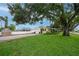 Charming single-story home featuring a well-manicured lawn and a detached garage at 1180 39Th N St, St Petersburg, FL 33713