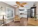 Bright kitchen nook featuring tile floors, a ceiling fan, window, and view into the kitchen at 1180 39Th N St, St Petersburg, FL 33713
