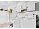 Bright laundry room with ample cabinet space and appliances at 1180 39Th N St, St Petersburg, FL 33713
