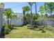 Green backyard featuring a shed, lush lawn, and privacy fence at 1183 35Th Ne Ave, St Petersburg, FL 33704