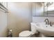 This half bathroom features a sleek pedestal sink, toilet, and modern fixtures at 1183 35Th Ne Ave, St Petersburg, FL 33704