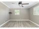 This bedroom features wood-look floors, neutral walls, crown moulding, and a ceiling fan at 1183 35Th Ne Ave, St Petersburg, FL 33704