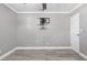 Simple bedroom with tile floors, painted gray walls, white door and prepped for TV mount at 1183 35Th Ne Ave, St Petersburg, FL 33704