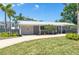 Attractive one-story home with an attached garage, lush lawn, and freshly landscaped front yard at 1183 35Th Ne Ave, St Petersburg, FL 33704