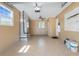 A spacious garage with speckled floors, bright lighting, and peg board at 1183 35Th Ne Ave, St Petersburg, FL 33704