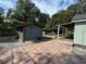 Spacious backyard showcasing shed and an outdoor entertaining deck for ultimate relaxation and enjoyment at 1211 E Curtis St, Tampa, FL 33603
