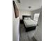 Cozy bedroom with black furnishings, light green bedding and great natural light at 1211 E Curtis St, Tampa, FL 33603