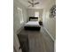 Bedroom featuring gray vinyl flooring, a ceiling fan and ample natural light at 1211 E Curtis St, Tampa, FL 33603